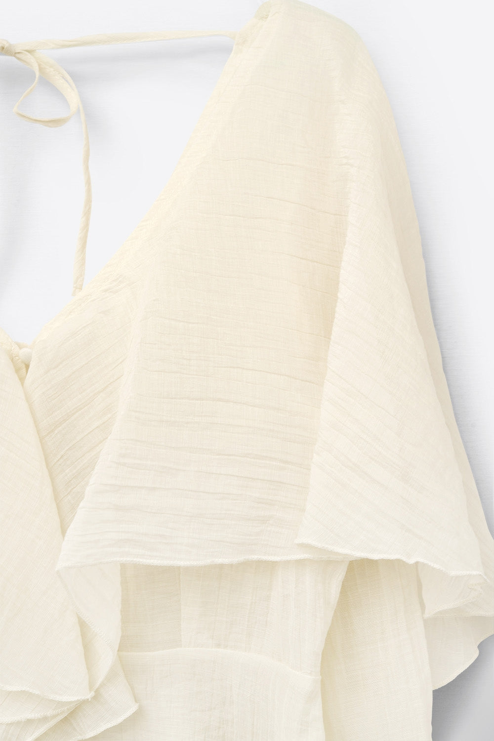 blusa corta in chiffon fluente con maniche lunghe