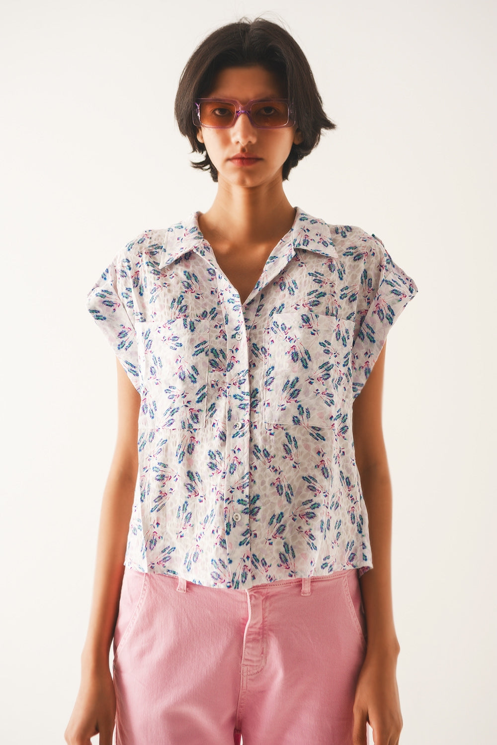 Q2 Blusa lilla con taschini e print floreale