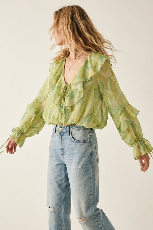 Q2 Blusa trasparente verde chiaro con volant e nodo frontale