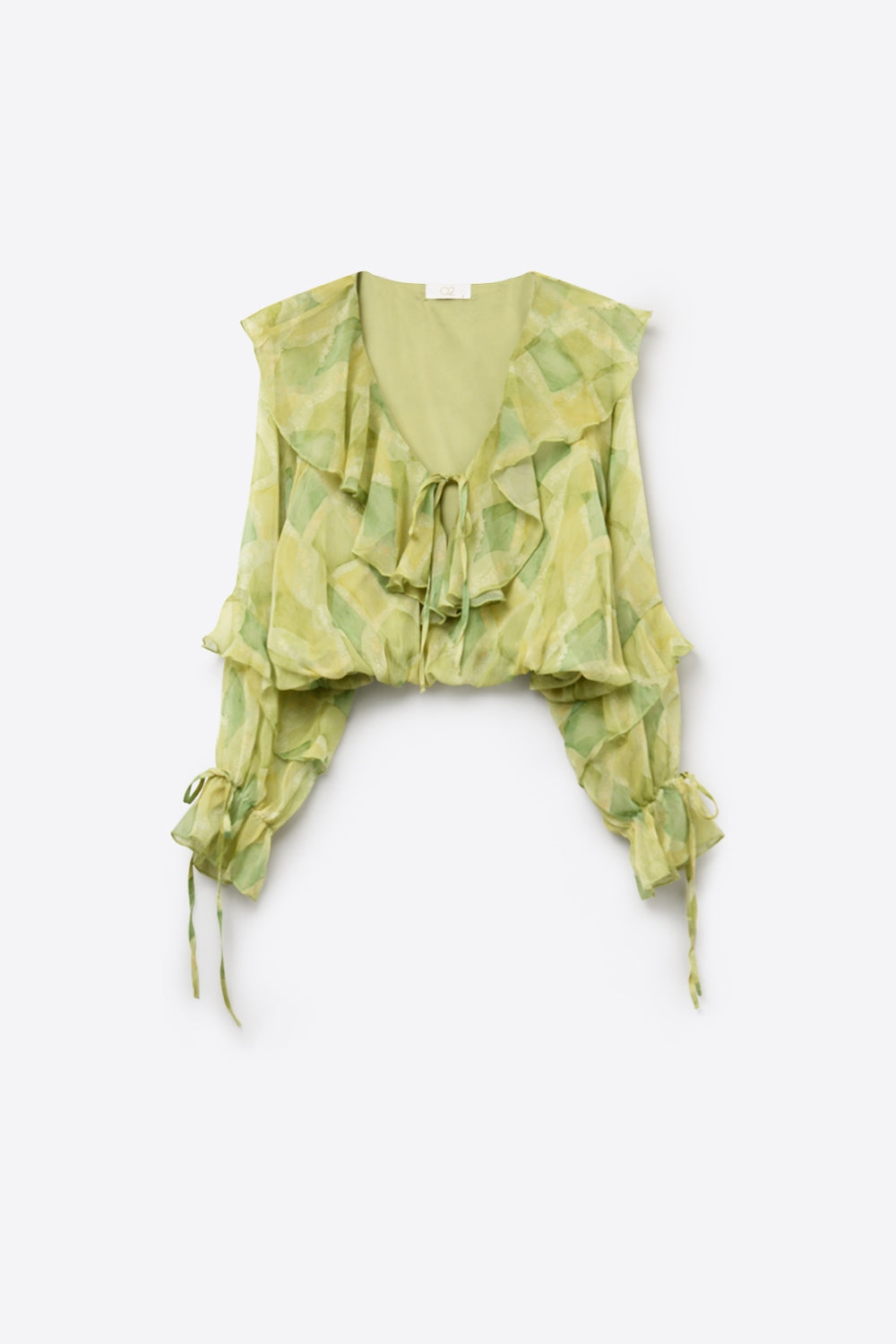 Blusa trasparente verde chiaro con volant e nodo frontale