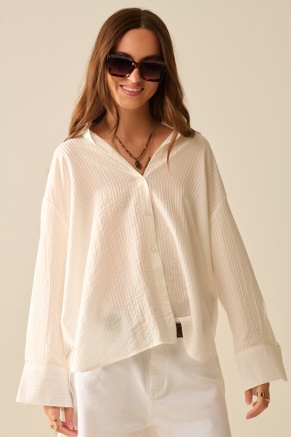 camicia bianca oversize con fiocco sul retro