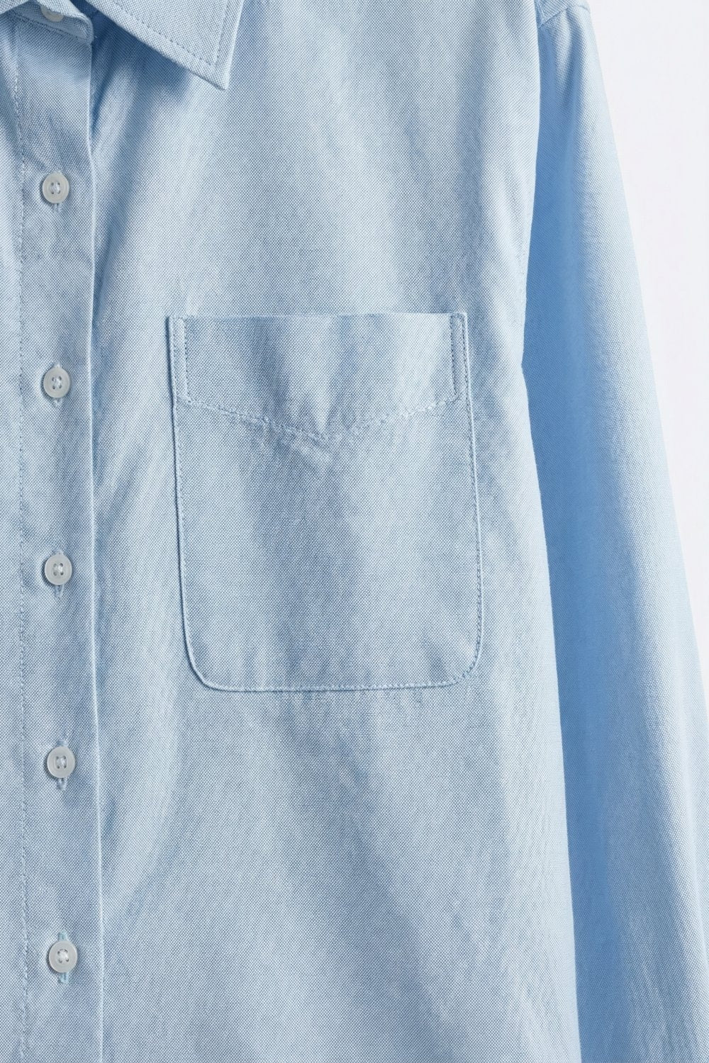 Camicia corta azzurra con bottoni in tessuto di cotone