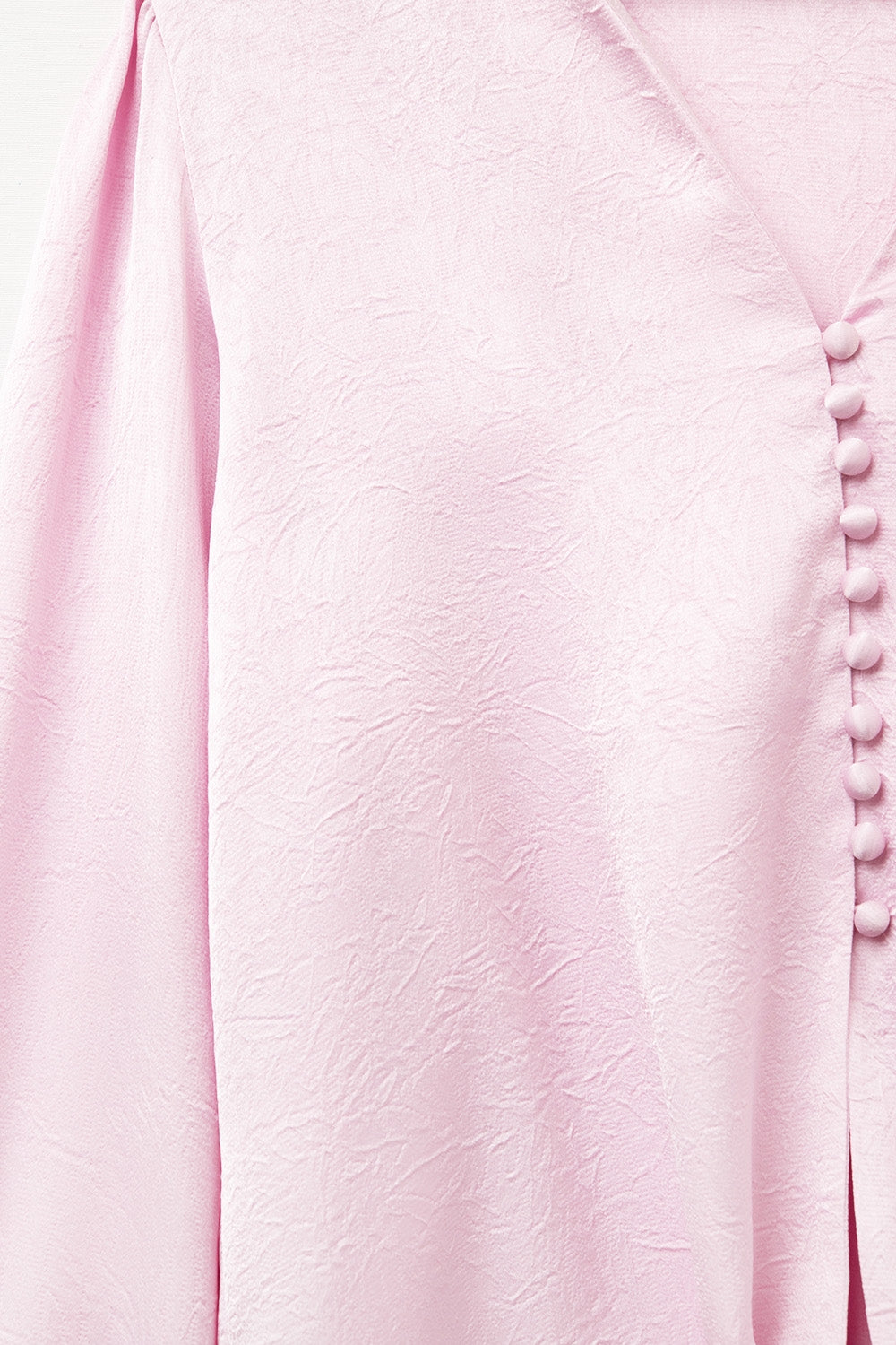 Camicia cropped in rosa con nodo