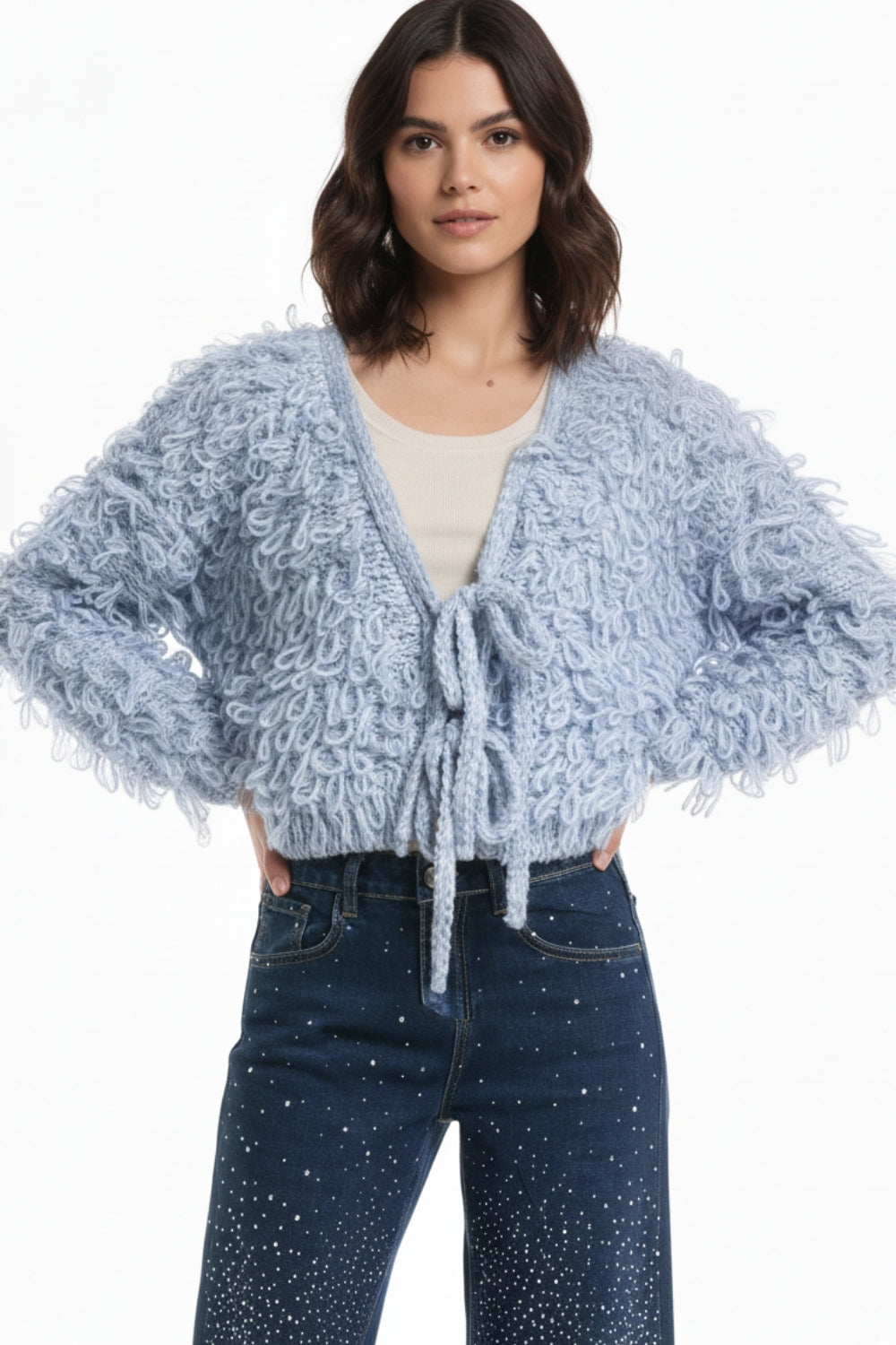 Cardigan blu in maglia grossa con scollo a V e chiusura frontale con fiocco