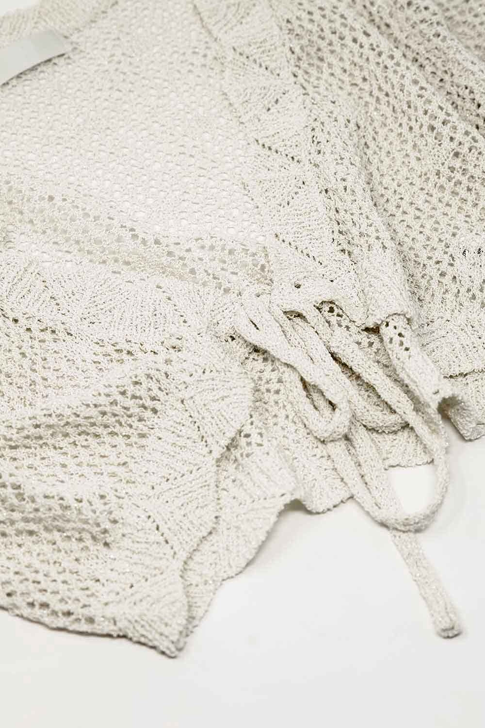 cardigan corto beige all'uncinetto con dettagli in lurex
