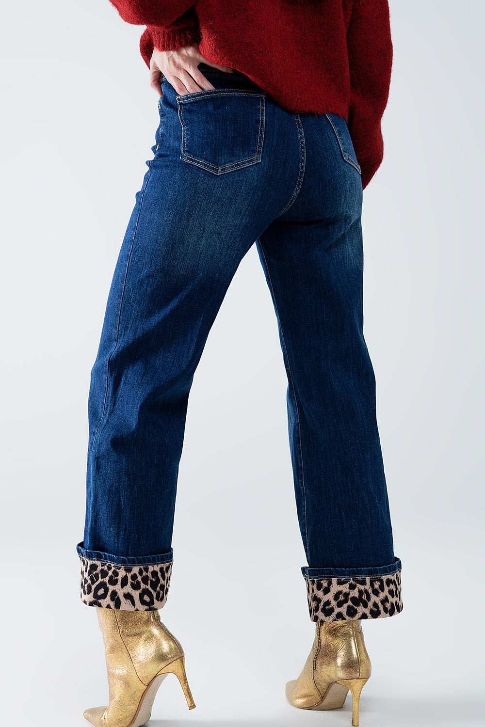 Jeans a gamba larga con striscia leopardata in basso