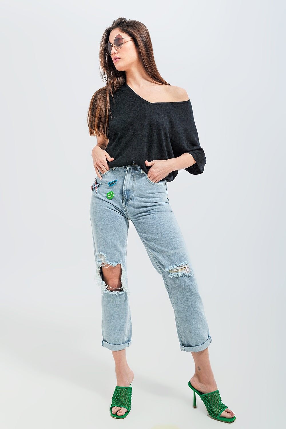 Jeans con strappi e toppe lavaggio chiaro