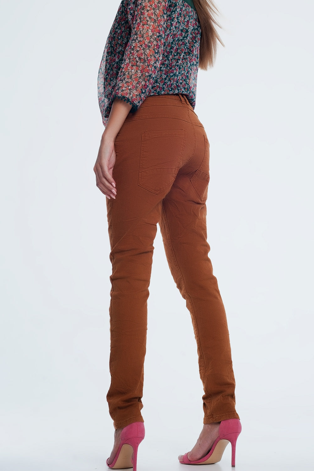 Jeans skinny arancione con cavallo basso