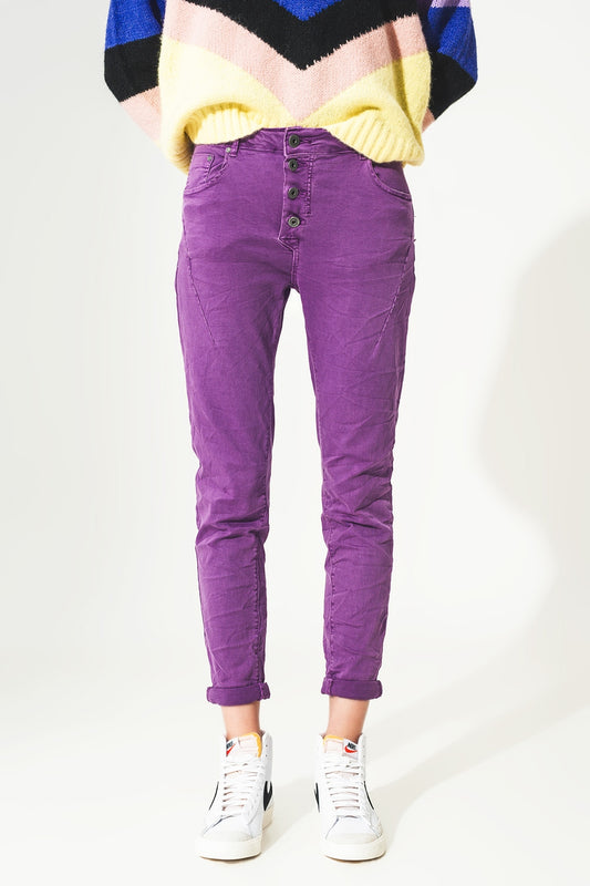Q2 Jeans skinny con bottoni a vista e lavaggio viola