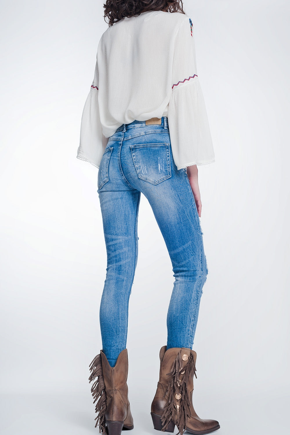 Jeans super skinny blu lavaggio vintage strappati