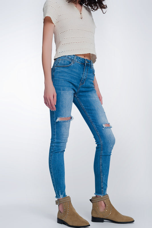 Q2 jeans super skinny con fori nelle ginocchia