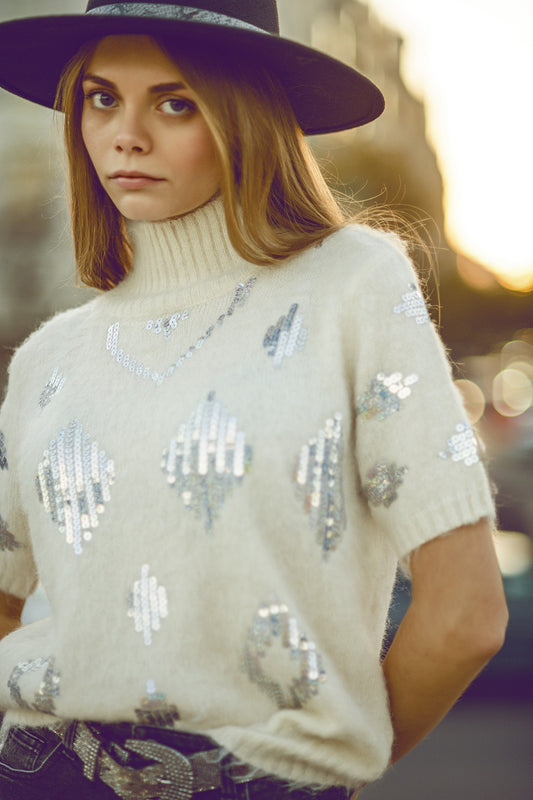 Maglione a maniche corte color crema con paillettes