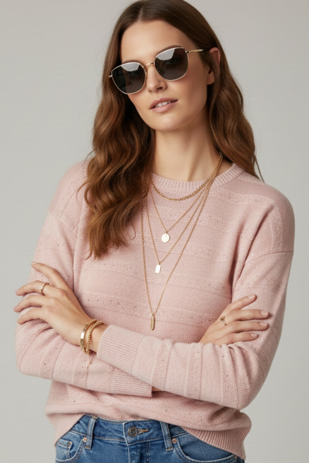 Maglione a righe rosa con dettaglio in paillettes