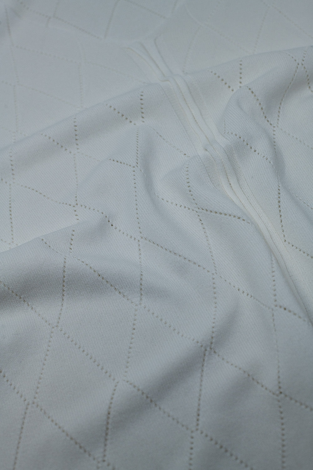 Maglione bianco a maniche corte con motivo argyle