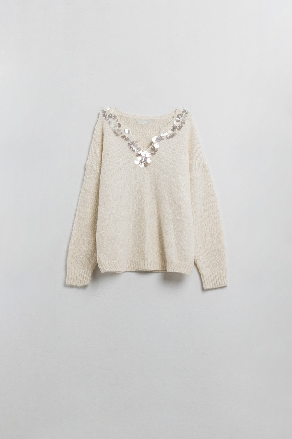 Maglione crema a V con dettaglio di paillettes
