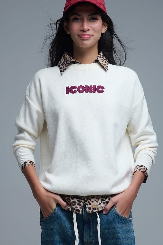 Q2 Maglione ICONIC ricamato con stampa posteriore Global Tour in crema