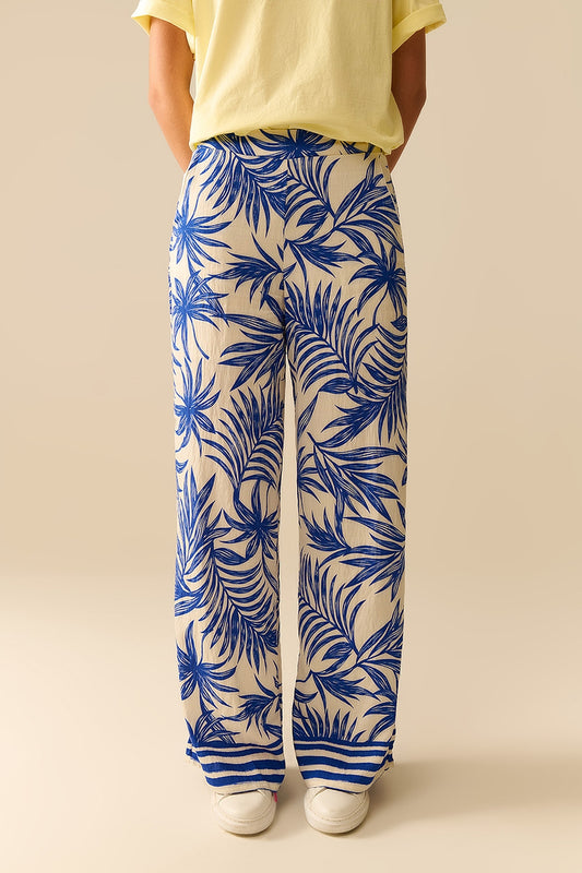 Q2 Pantaloni a gamba larga bianchi con stampa tropicale blu