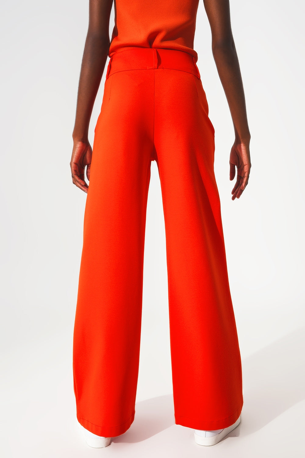 Pantaloni con fondo ampio arancio con bottoni