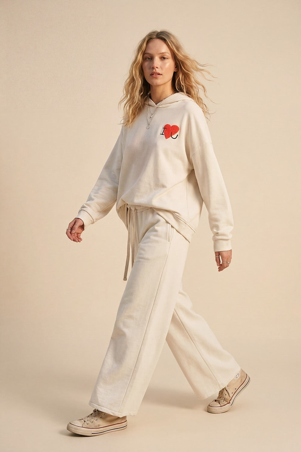 Pantaloni da ginnastica dritti in maglia panna con elastico in vita e cravatta