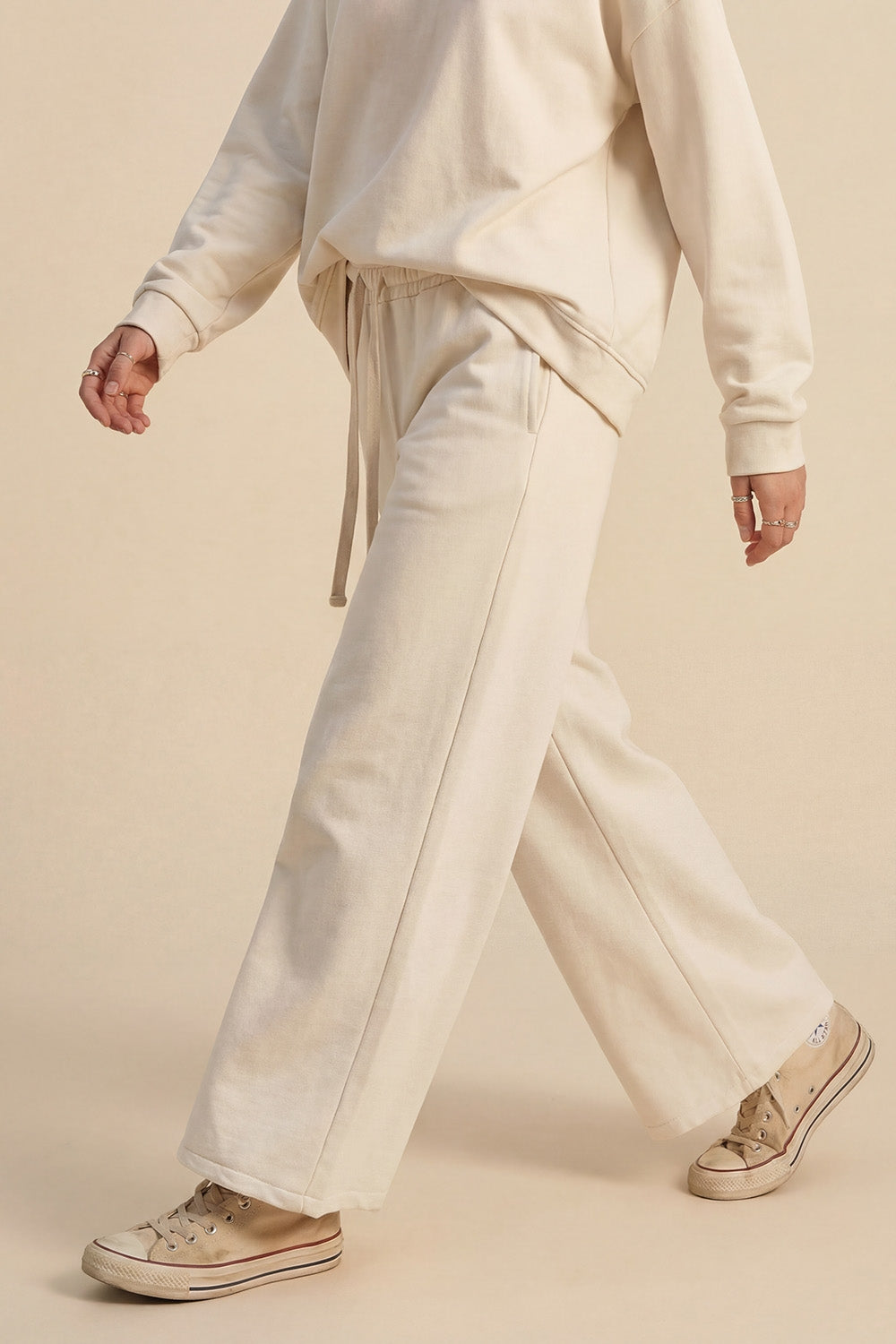 Pantaloni da ginnastica dritti in maglia panna con elastico in vita e cravatta