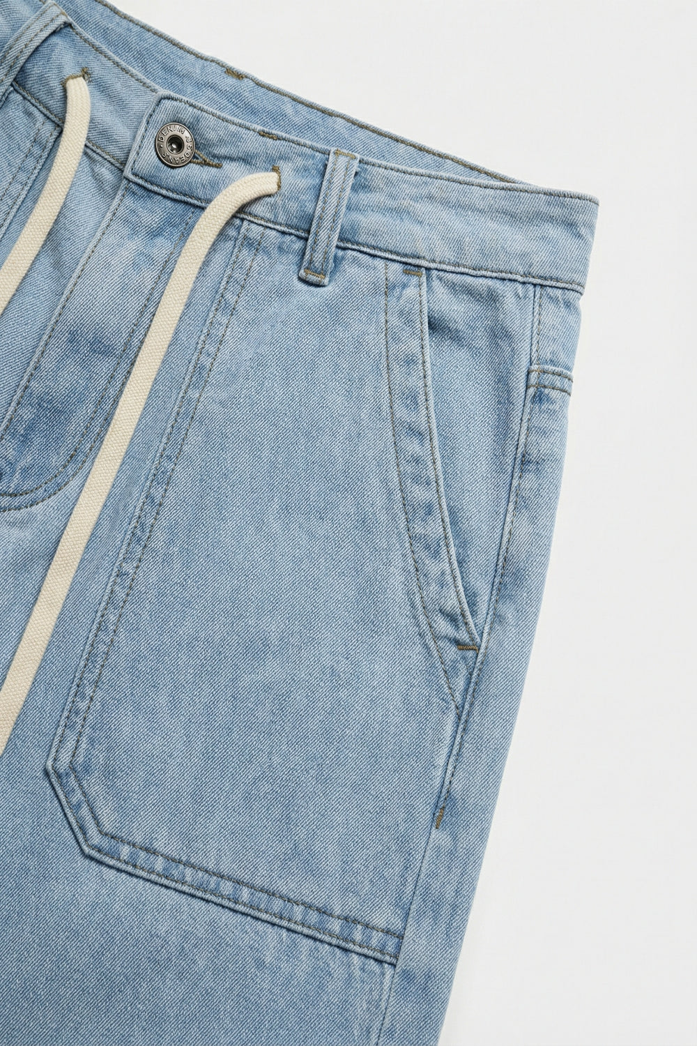 Pantaloni di jeans azzurri a gamba larga con vita con coulisse