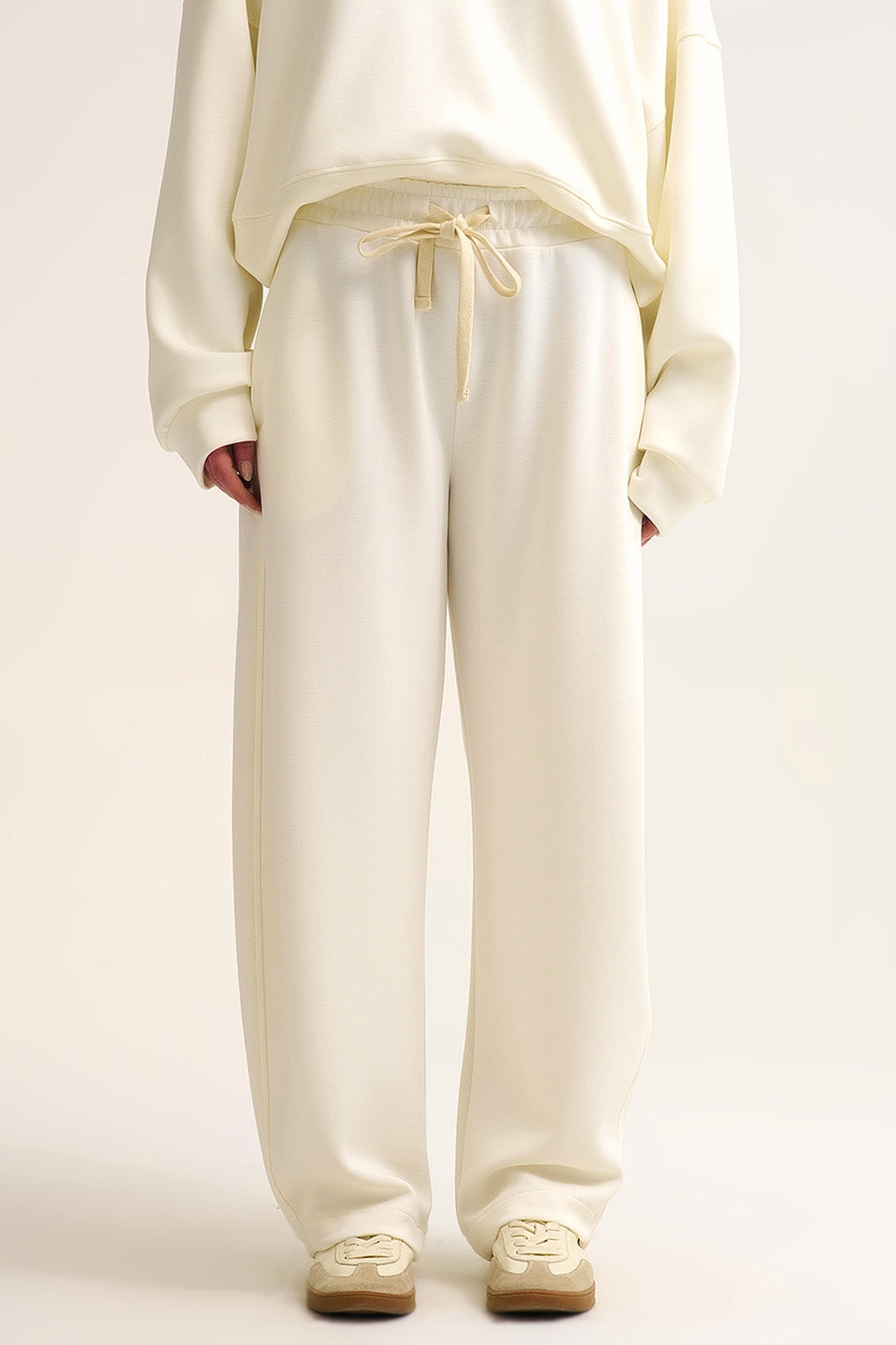 Q2 Pantaloni jogger in maglia morbidissima color crema con coulisse in vita