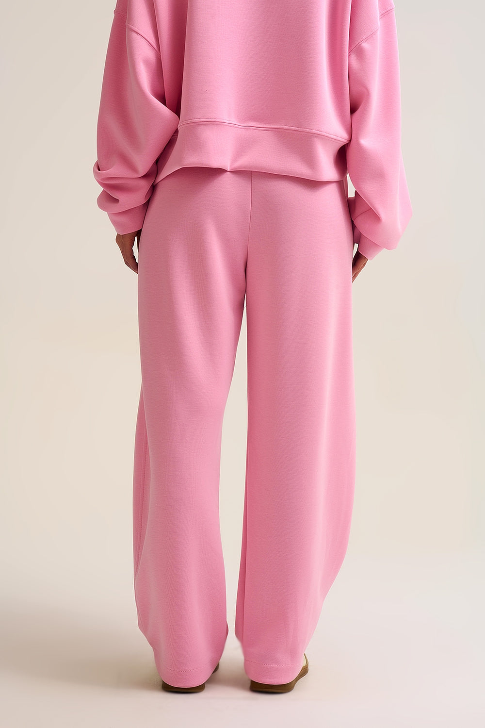 Pantaloni jogger in maglia morbidissima di colore rosa con coulisse in vita