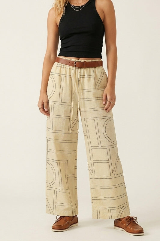 Q2 Pantaloni lounge beige a gamba larga con stampa geometrica