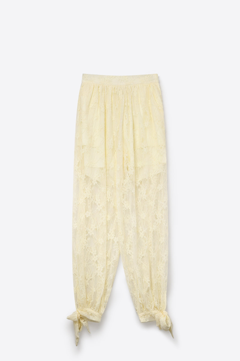 Pantaloni rilassati con orlo trasparente in pizzo floreale color crema