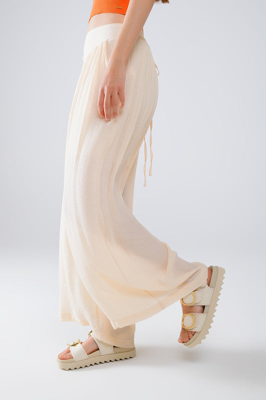 Q2 Pantaloni stile palazzo beige con tasche laterali e banda spessa in vita