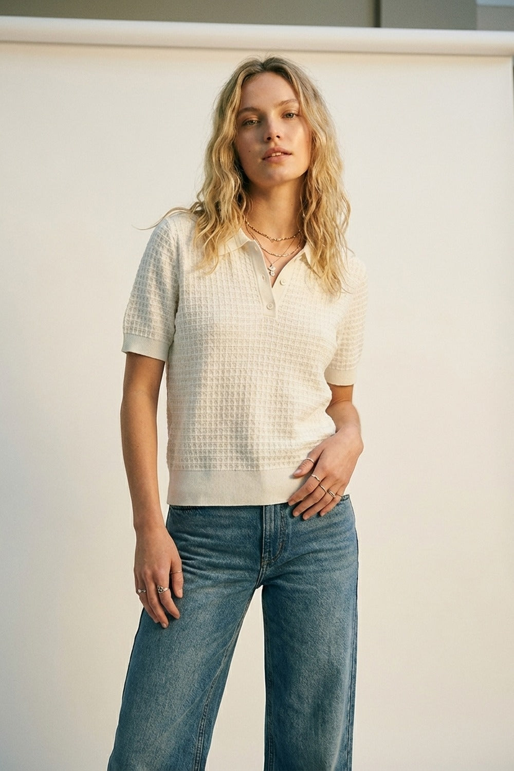 Polo a maniche corte in maglia strutturata color crema