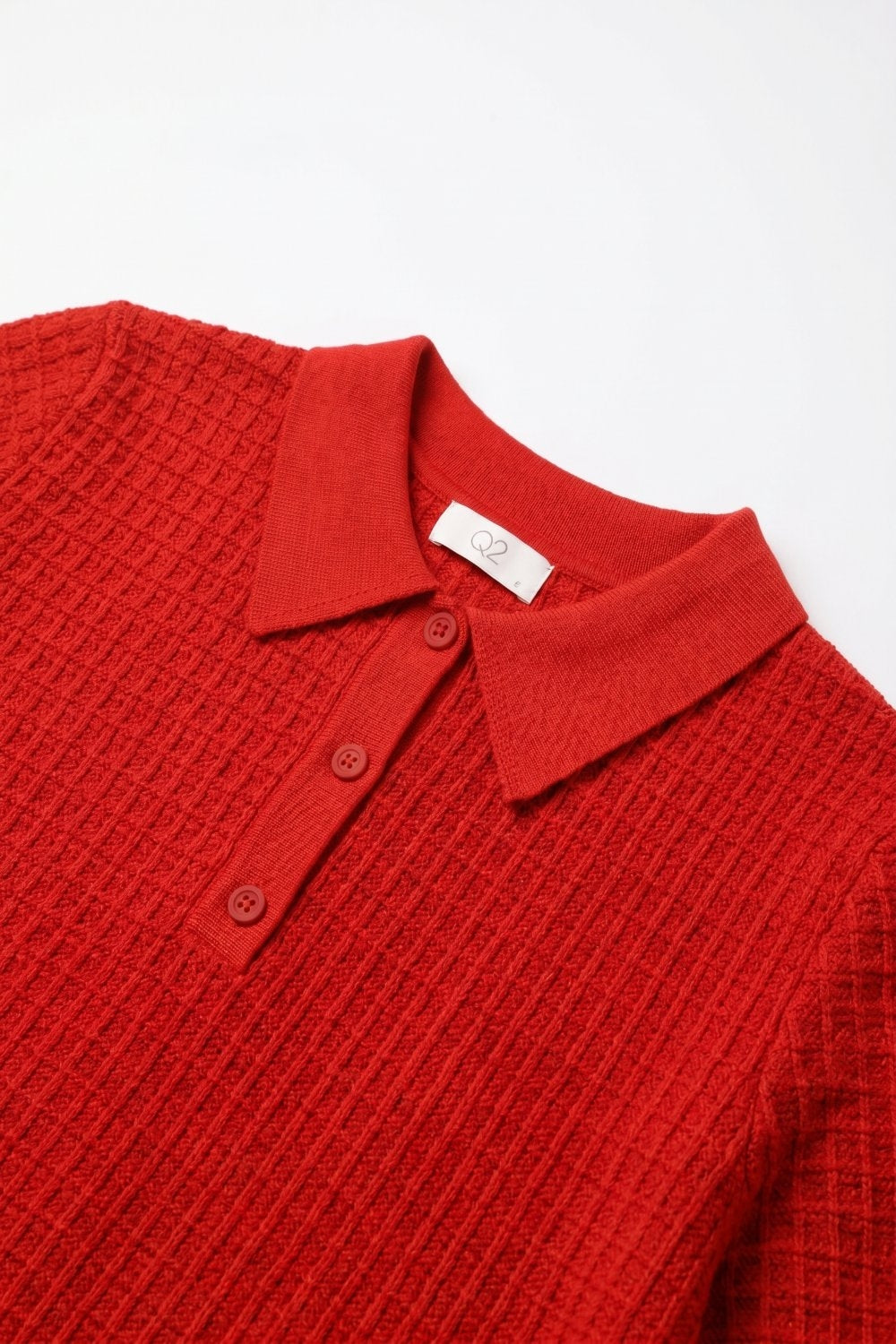 Polo in maglia a nido d'ape con abbottonatura in rosso a manica corta