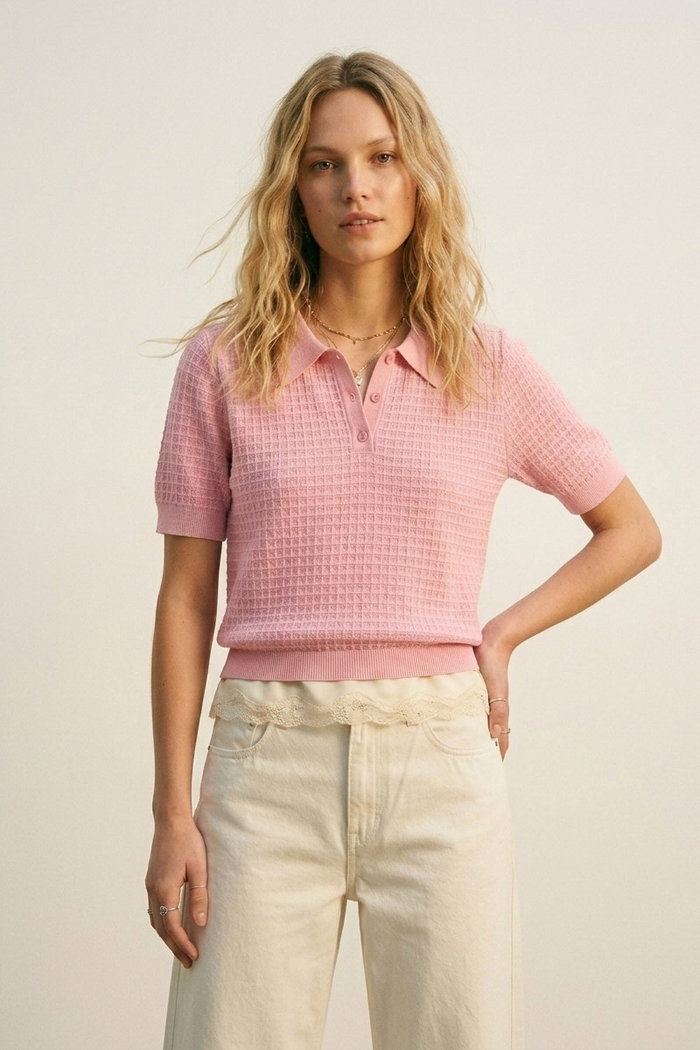 Polo in maglia a nido d'ape con bottoni in rosa con manica corta