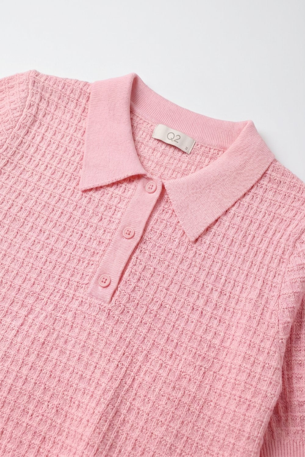 Polo in maglia a nido d'ape con bottoni in rosa con manica corta