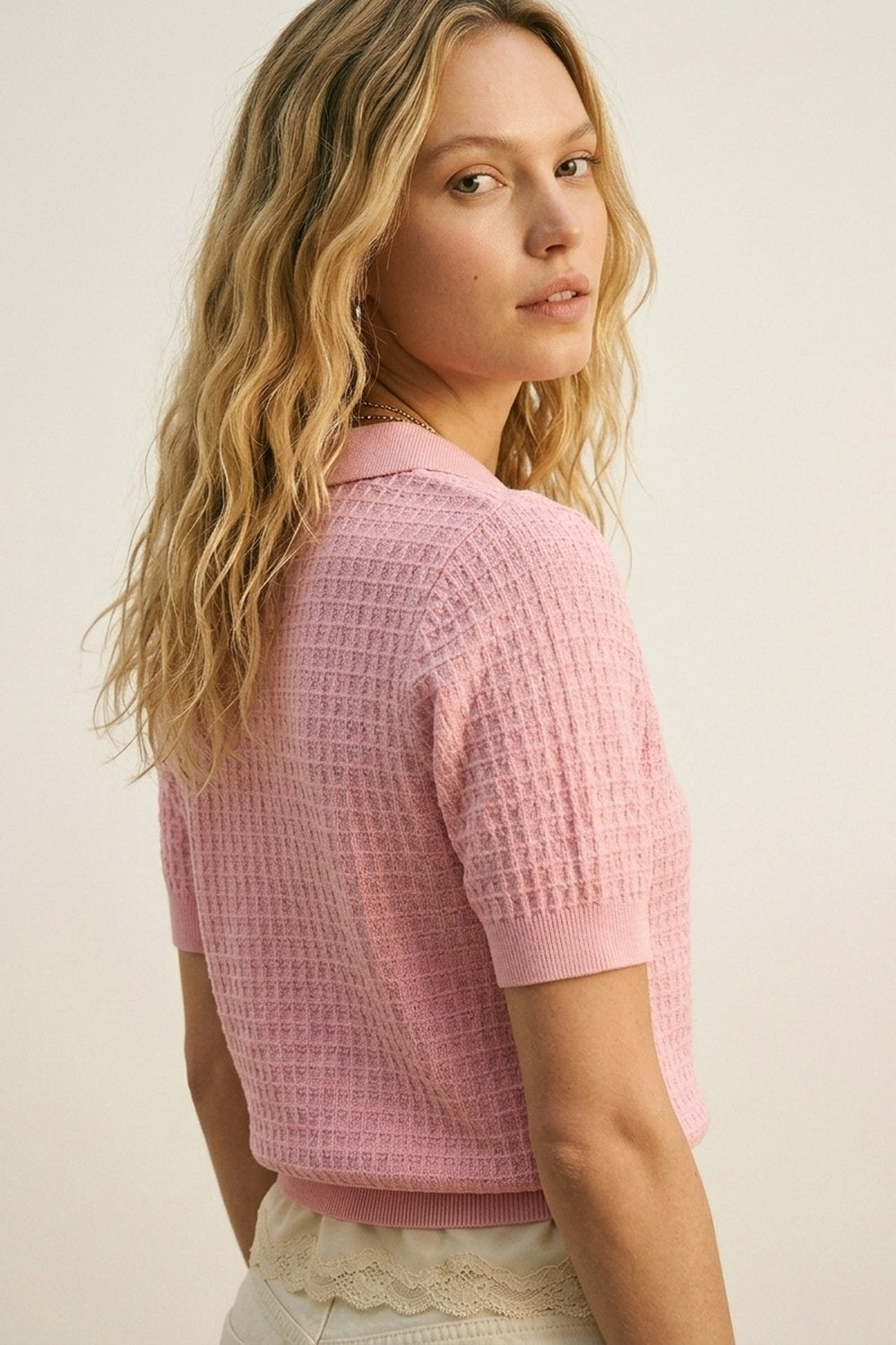 Polo in maglia a nido d'ape con bottoni in rosa con manica corta