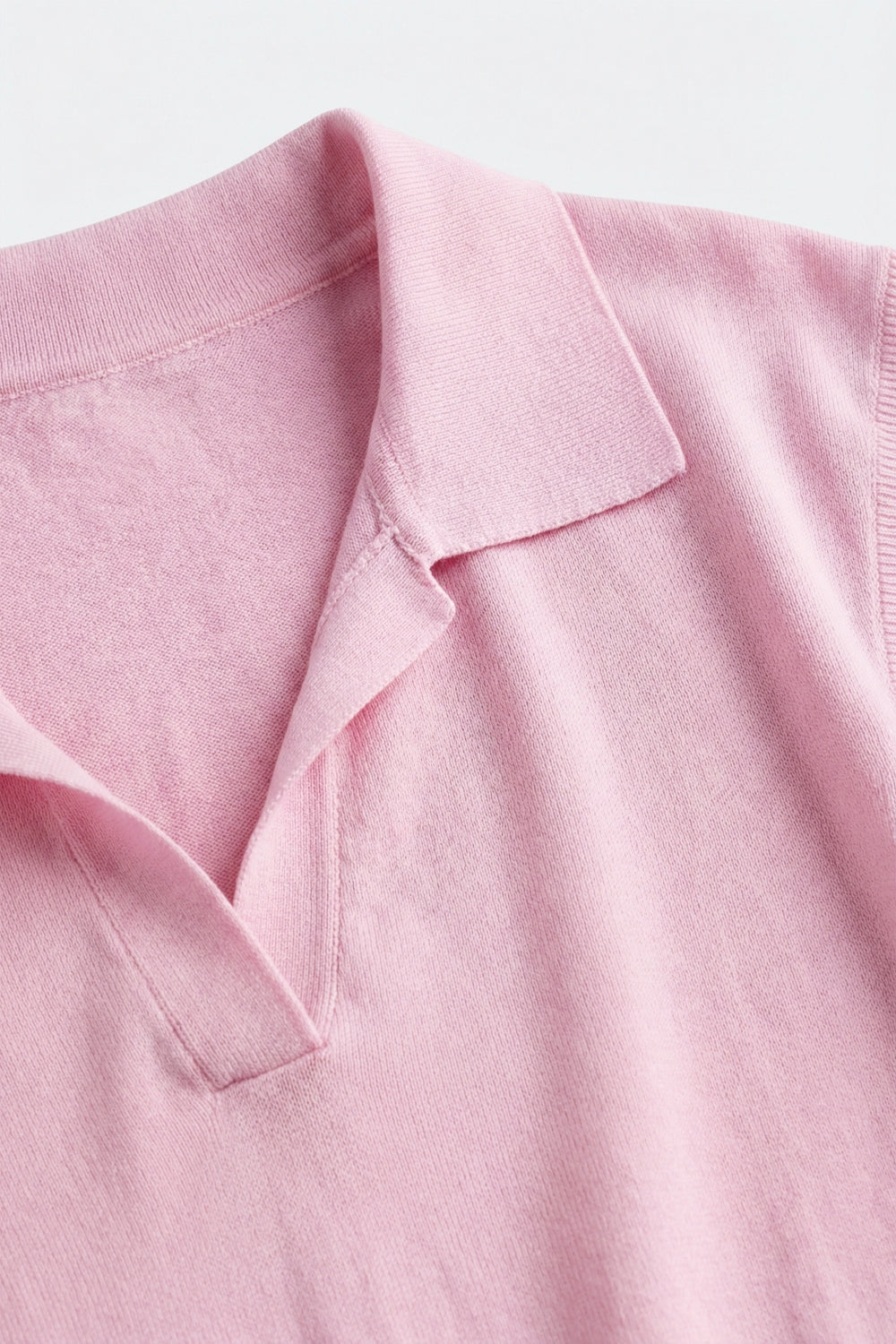 Polo in maglia leggera rosa con maniche corte
