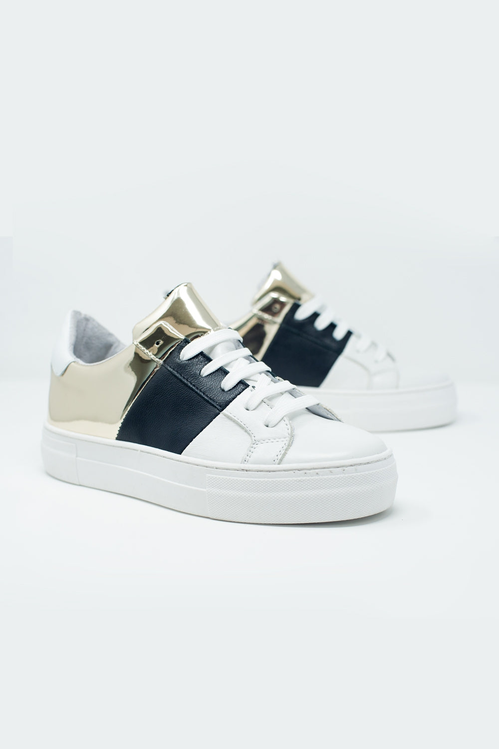 Sneakers nere e oro con suola spessa