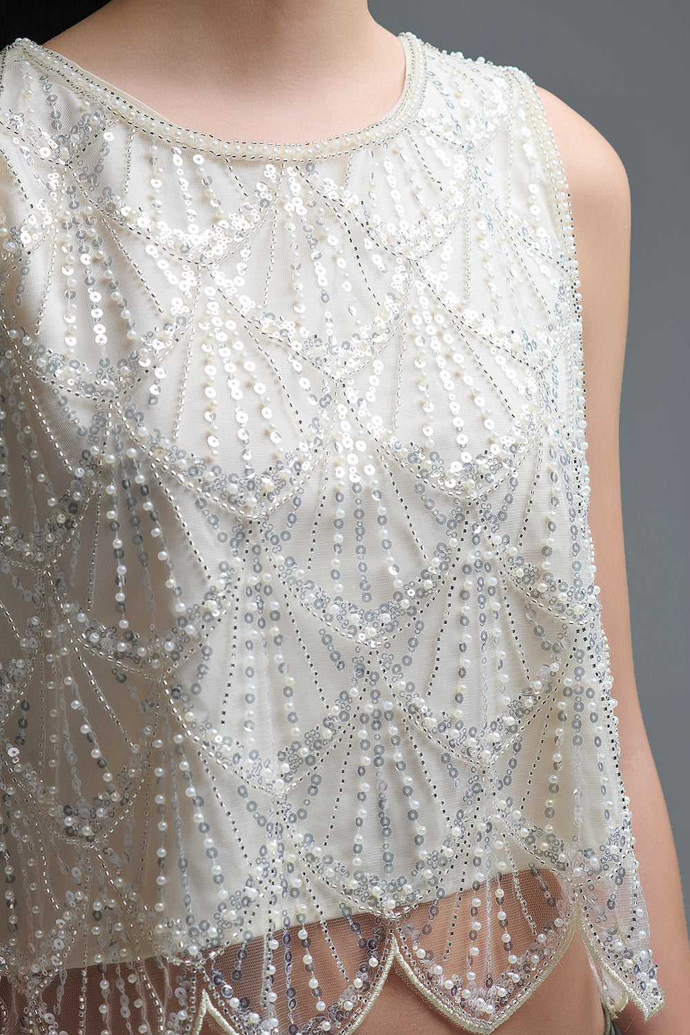 Top chic corto con paillettes in panna