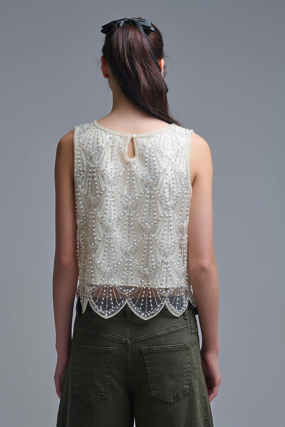 Top chic corto con paillettes in panna