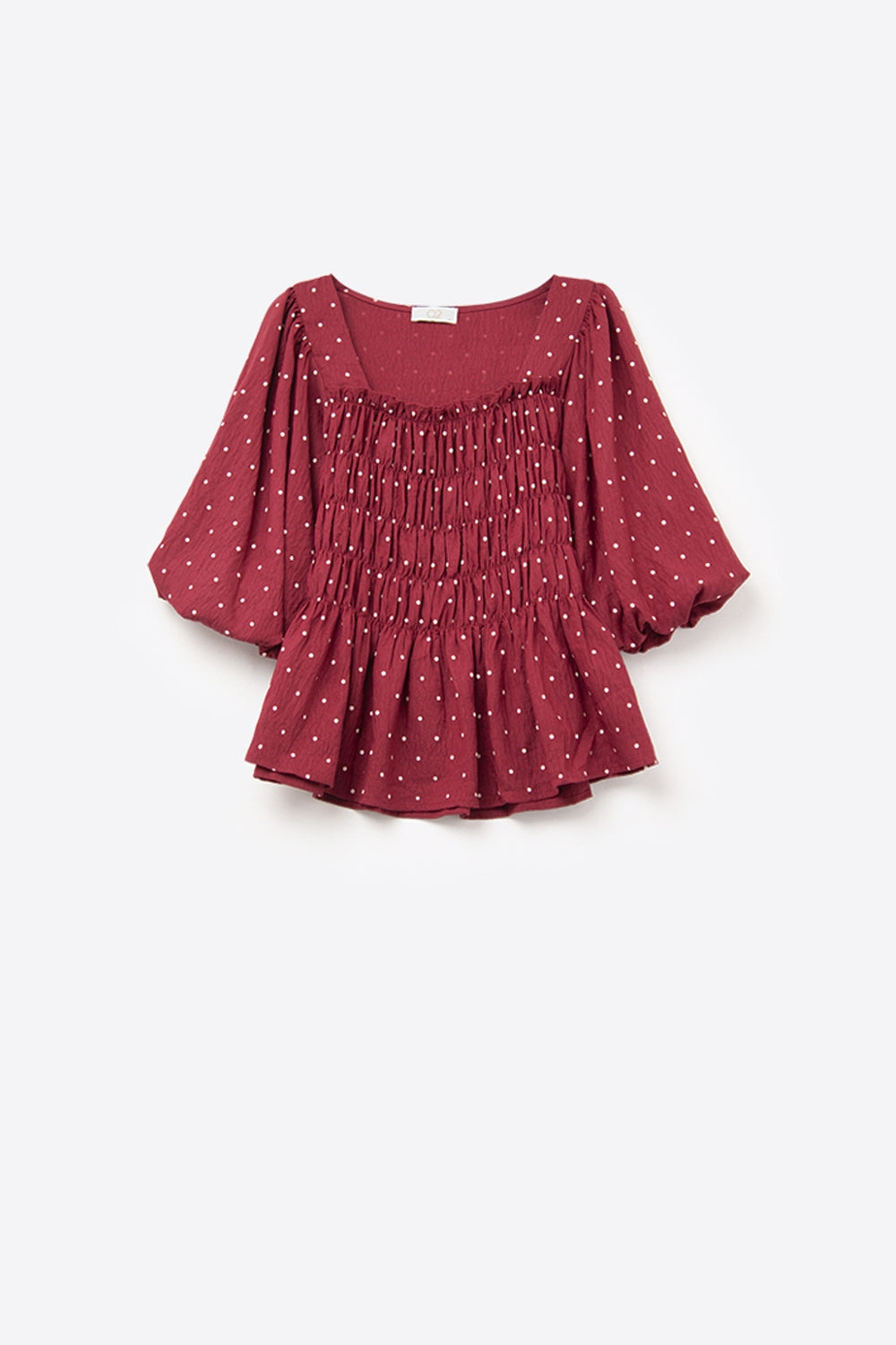 Top chic rosso a pois aderente in vita