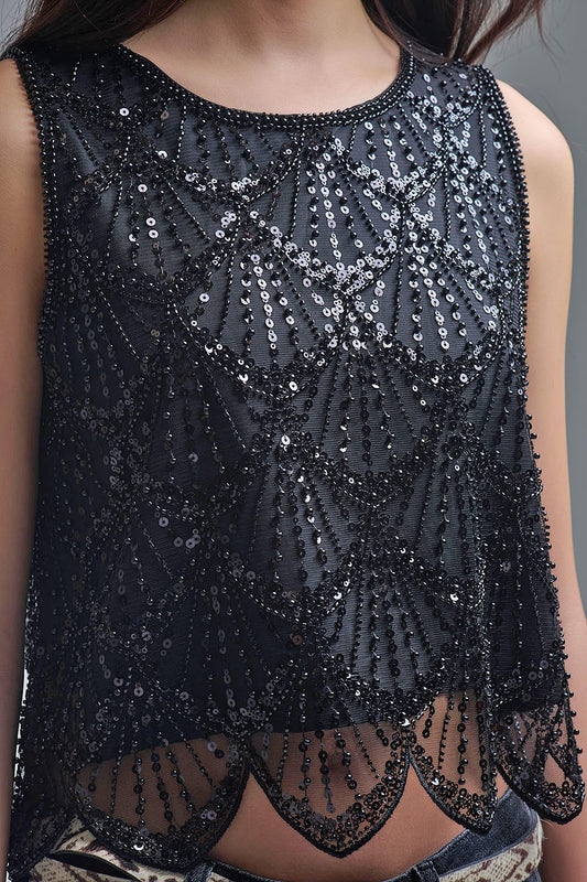 Top corto con paillettes nere chic