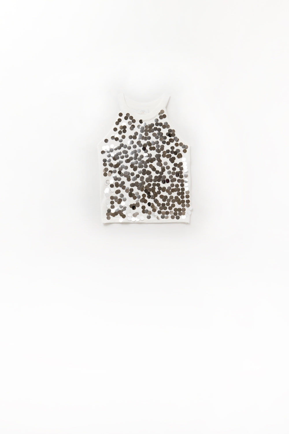 Top in maglia bianca con dettagli in paillettes