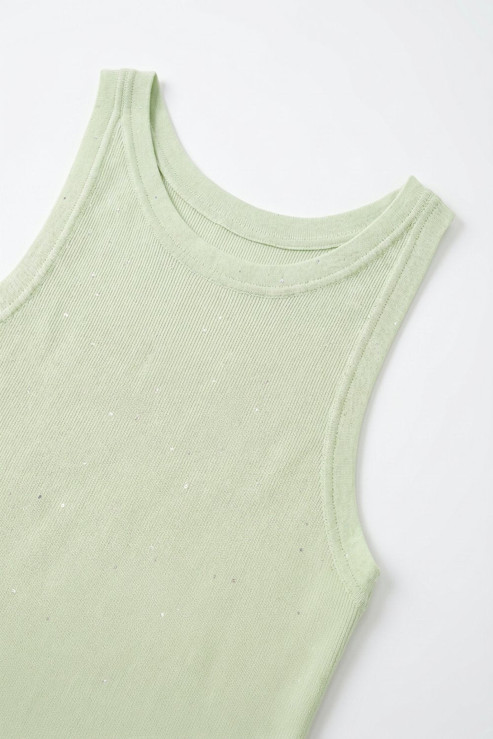 Top senza maniche in maglia fine di menta con sottili glitter