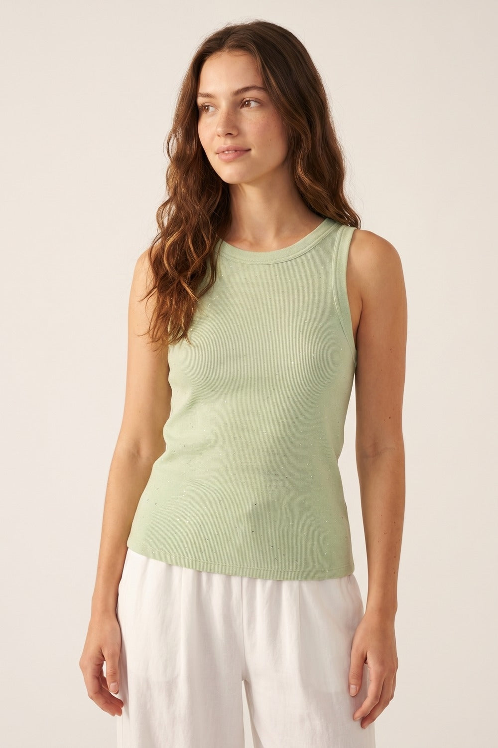 Top senza maniche in maglia fine di menta con sottili glitter