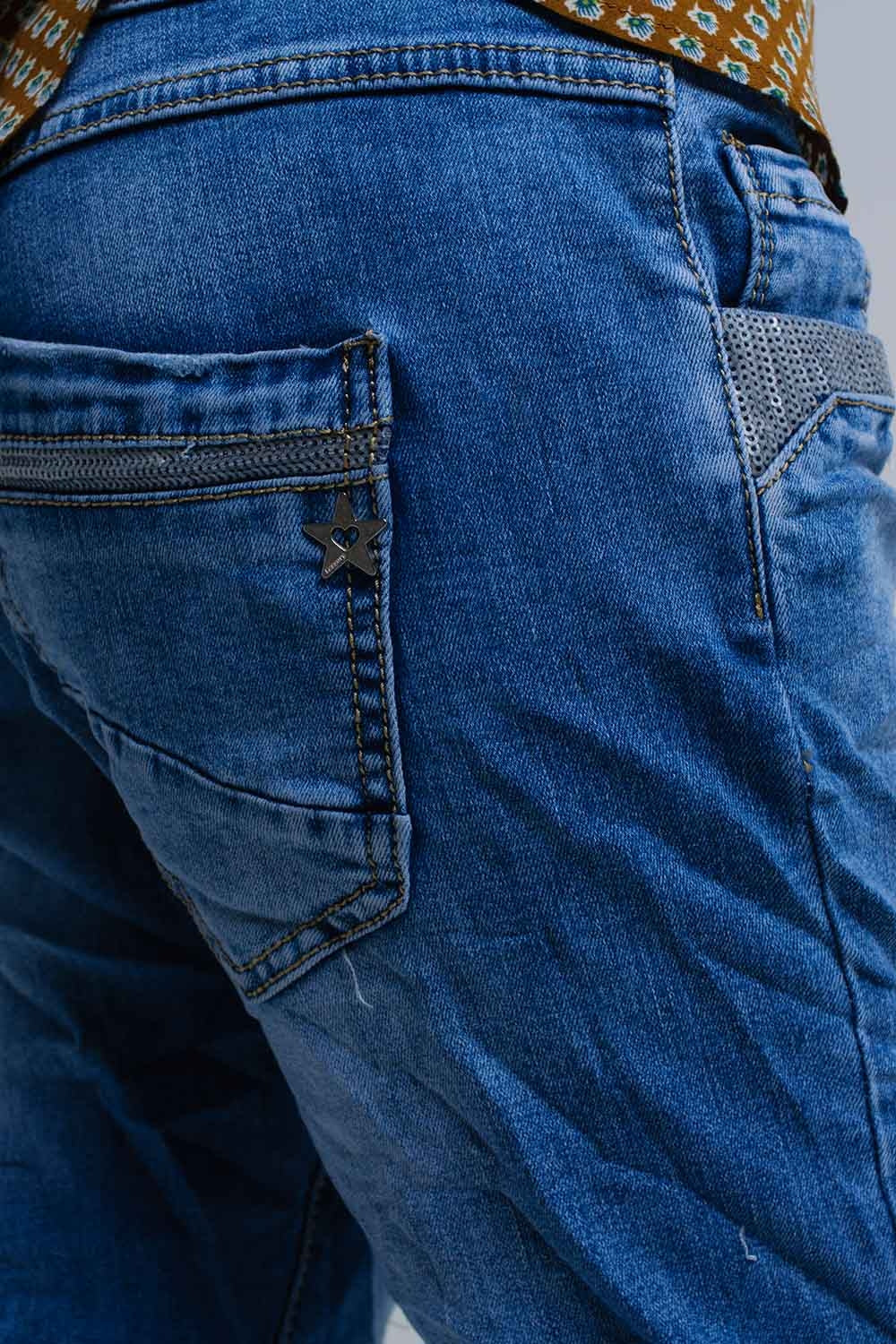 Jeans skinny blu con dettagli in paillettes