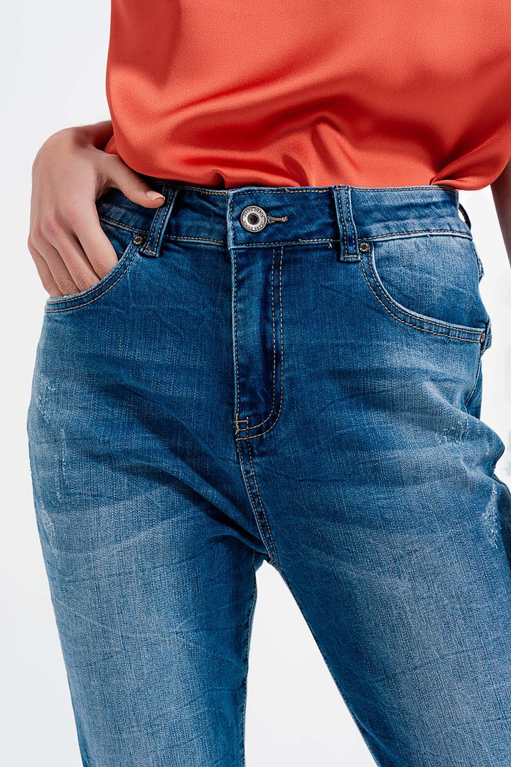 Jeans skinny blu lavaggio scuro con abrasioni