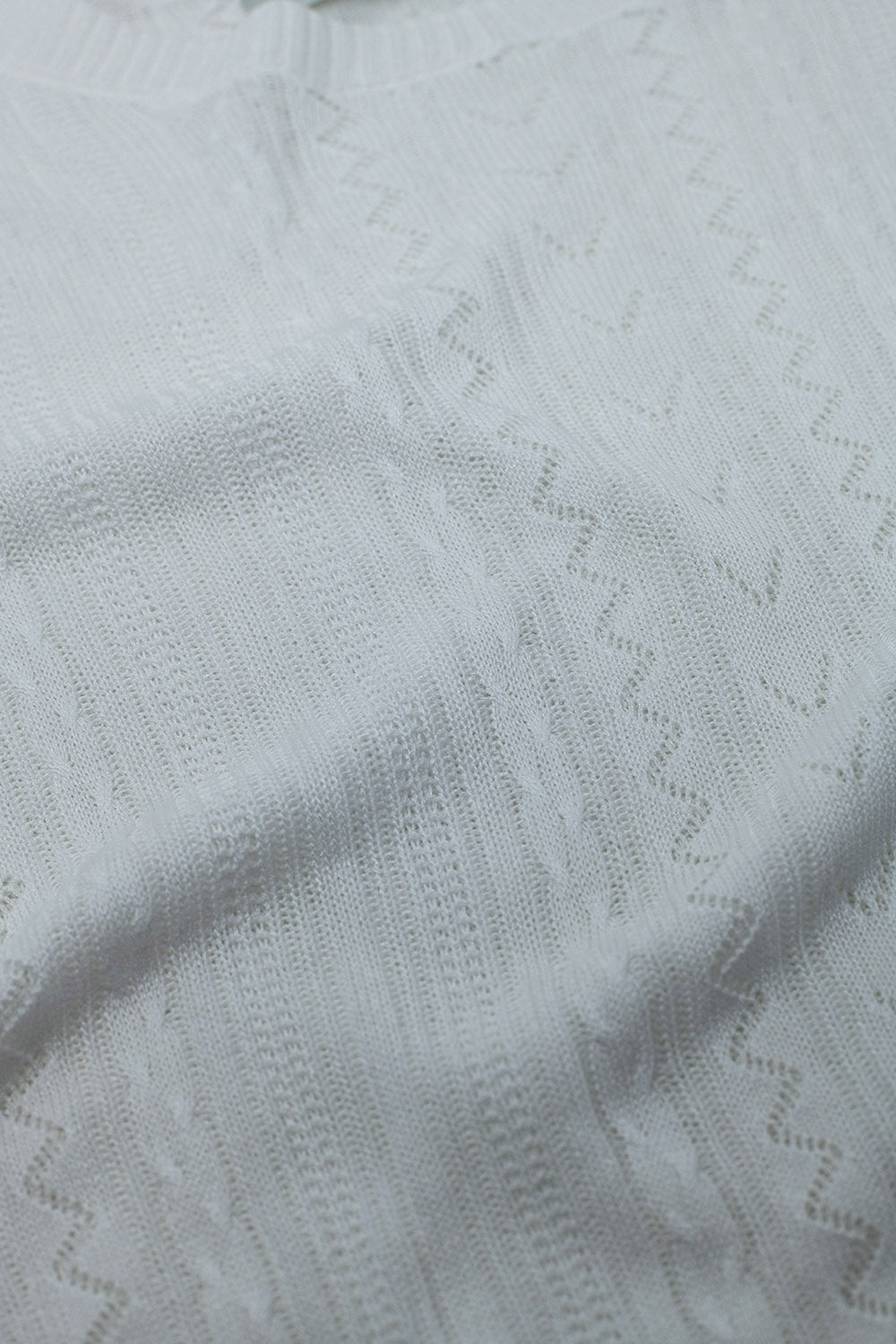 Maglia con maniche a 3/4 in maglia bianca e dettagli a righe zig zag