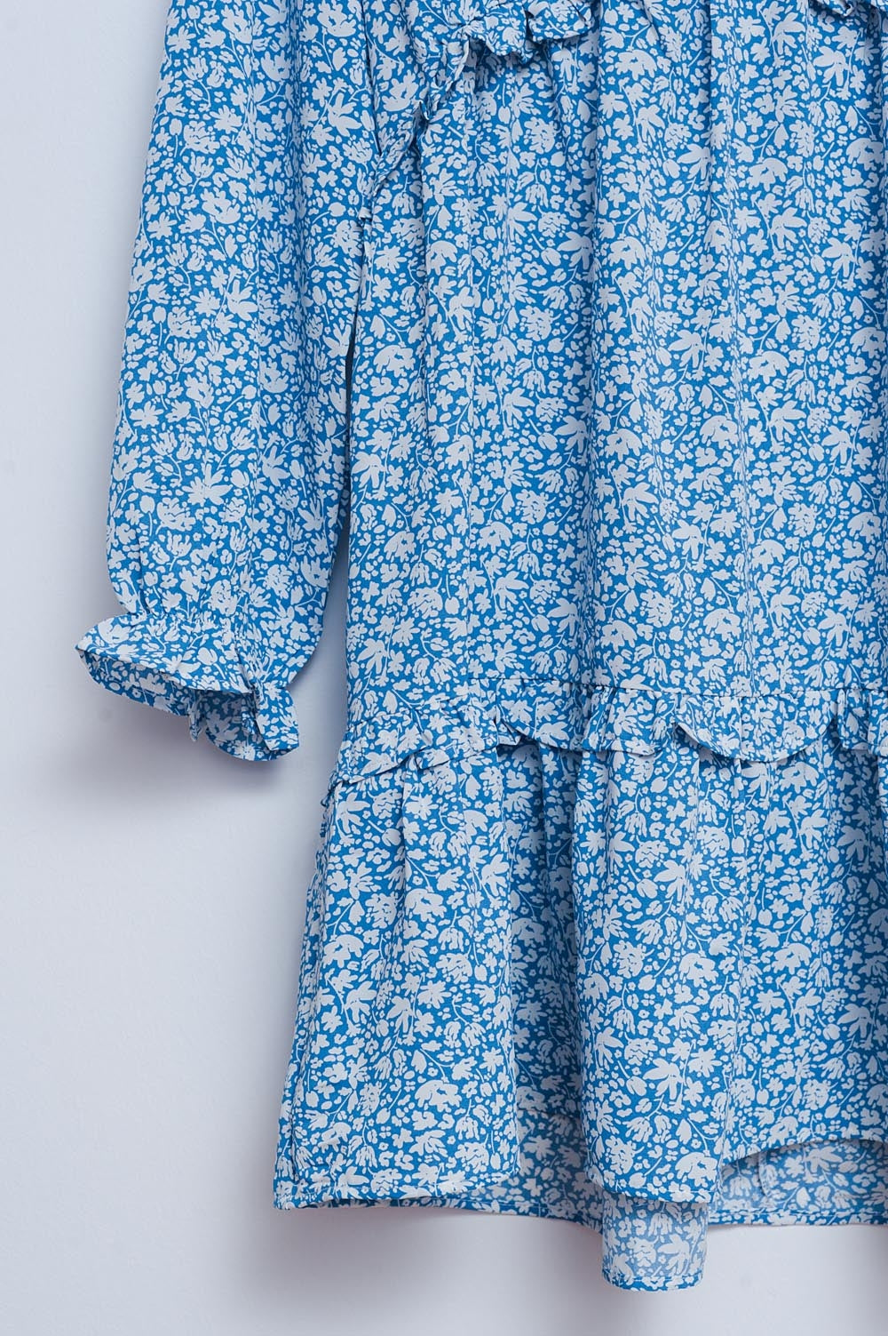 Vestito corto azzurro da giorno aperto sul retro con stampa floreale